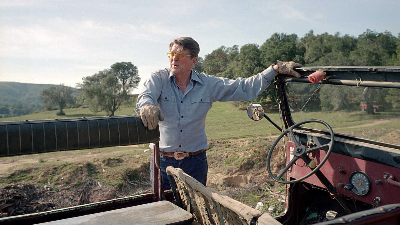 Ronald Reagan with the red Reagan Willys CJ-6 at Rancho del Cielo