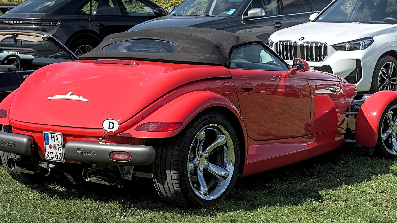 A red Plymouth Prowler with its top down