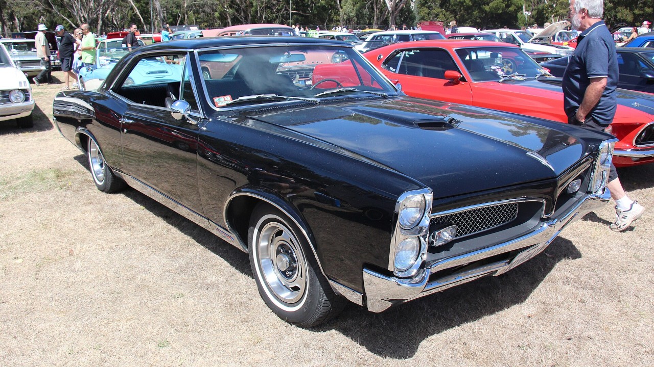A dark 1967 Pontiac GTO hardtop