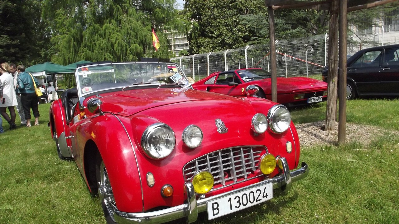 A red Triumph TR2, the first Triumph TR sports car