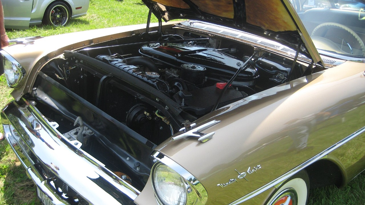 The engine bay of a 1957 Oldsmobile 98 Starfire
