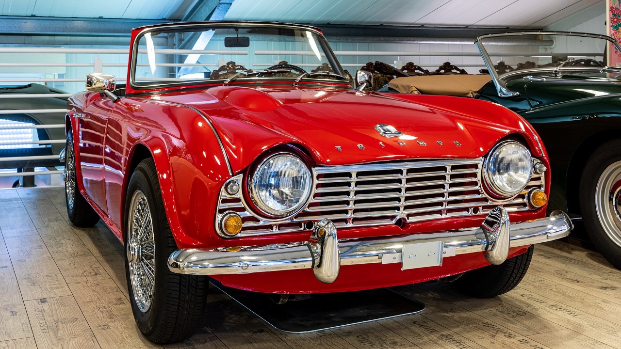 A red Triumph TR4 with Michelotti styling
