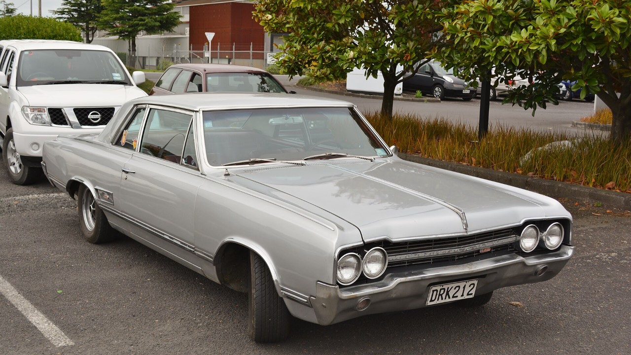 A 1965 Oldsmobile 4-4-2 sport coupe