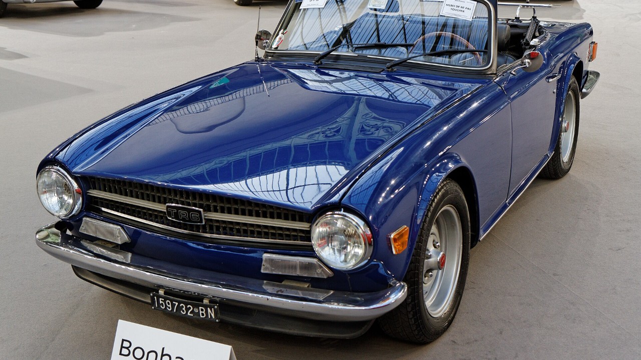 A blue 1974 Triumph TR6 roadster