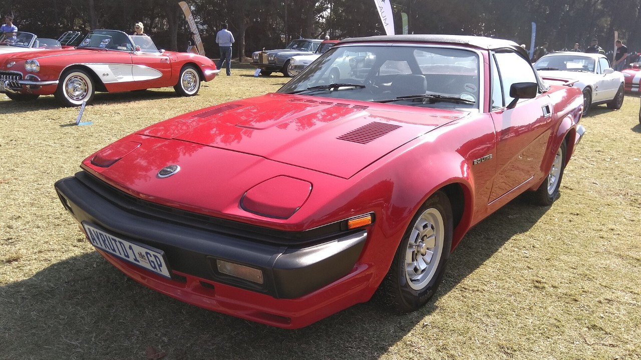 A red Triumph TR7 coupe