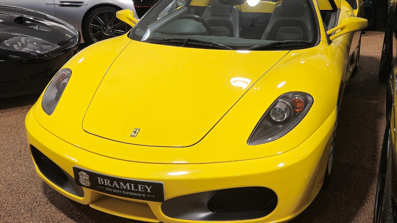 A yellow Ferrari F430 Spider