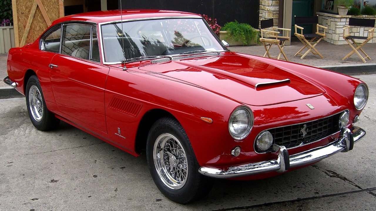 A red 1962 Ferrari 250 GTE 2+2