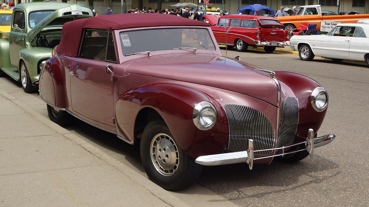 A maroon 1940 Lincoln Continental