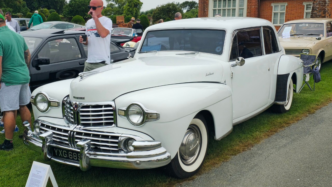 A white 1948 Lincoln Continental, the last Lincoln V12 car