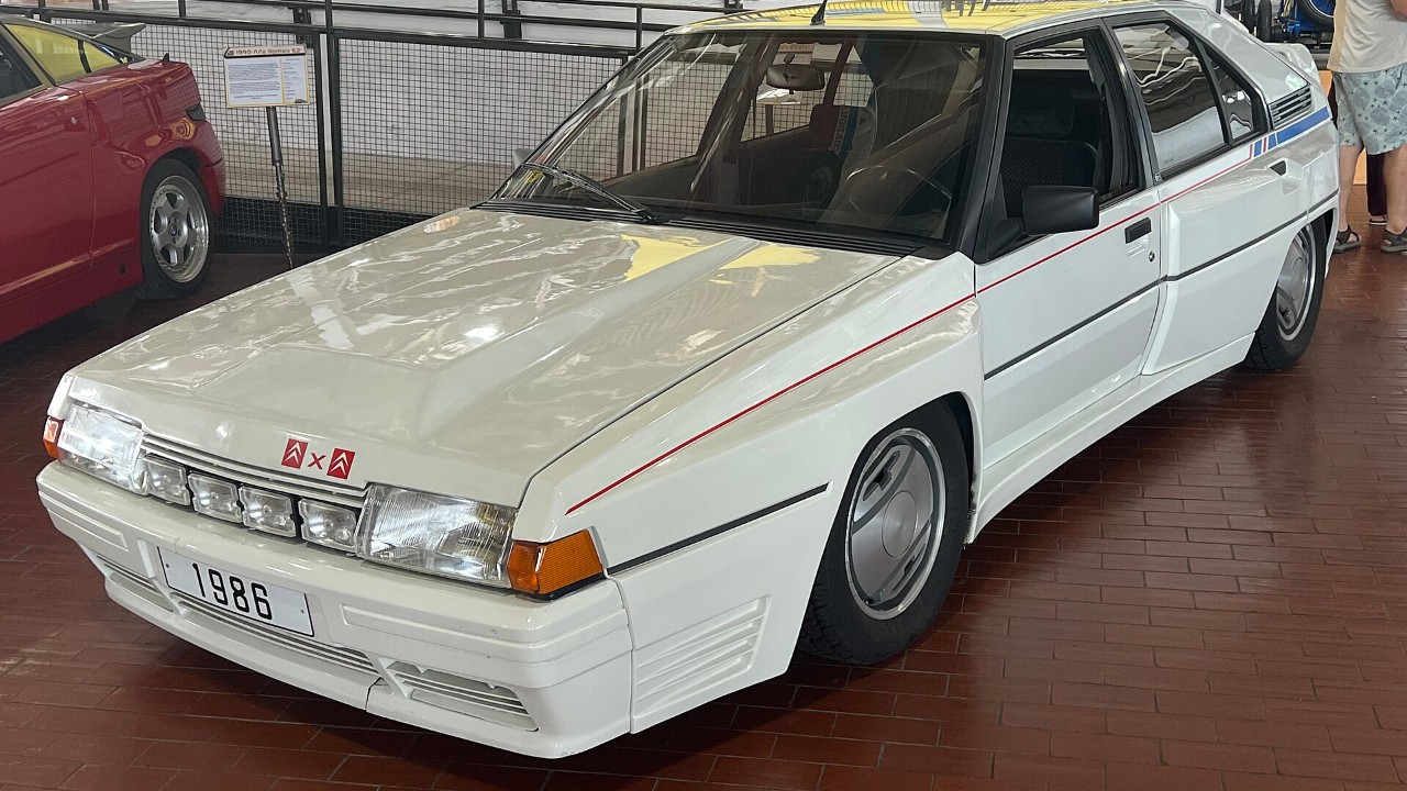 A white 1986 Citroën BX 4TC, a Group B homologation special, at the Lane Motor Museum