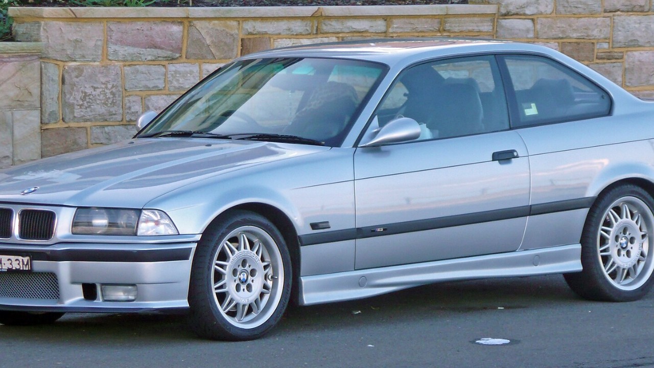 A silver BMW M3 E36 coupe