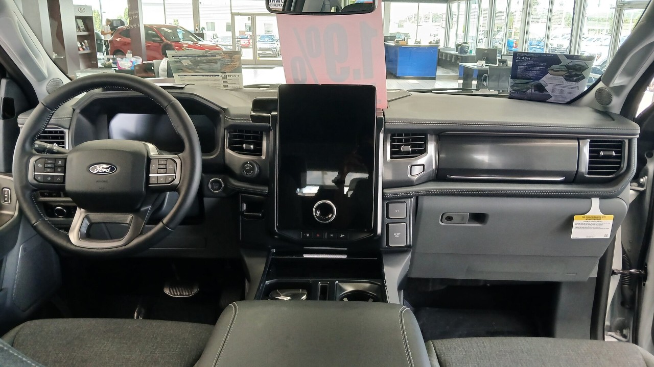 Front seats and dashboard of a 2024 Ford F-150 Lightning, a cabin like the trucks in the F-150 seat recall
