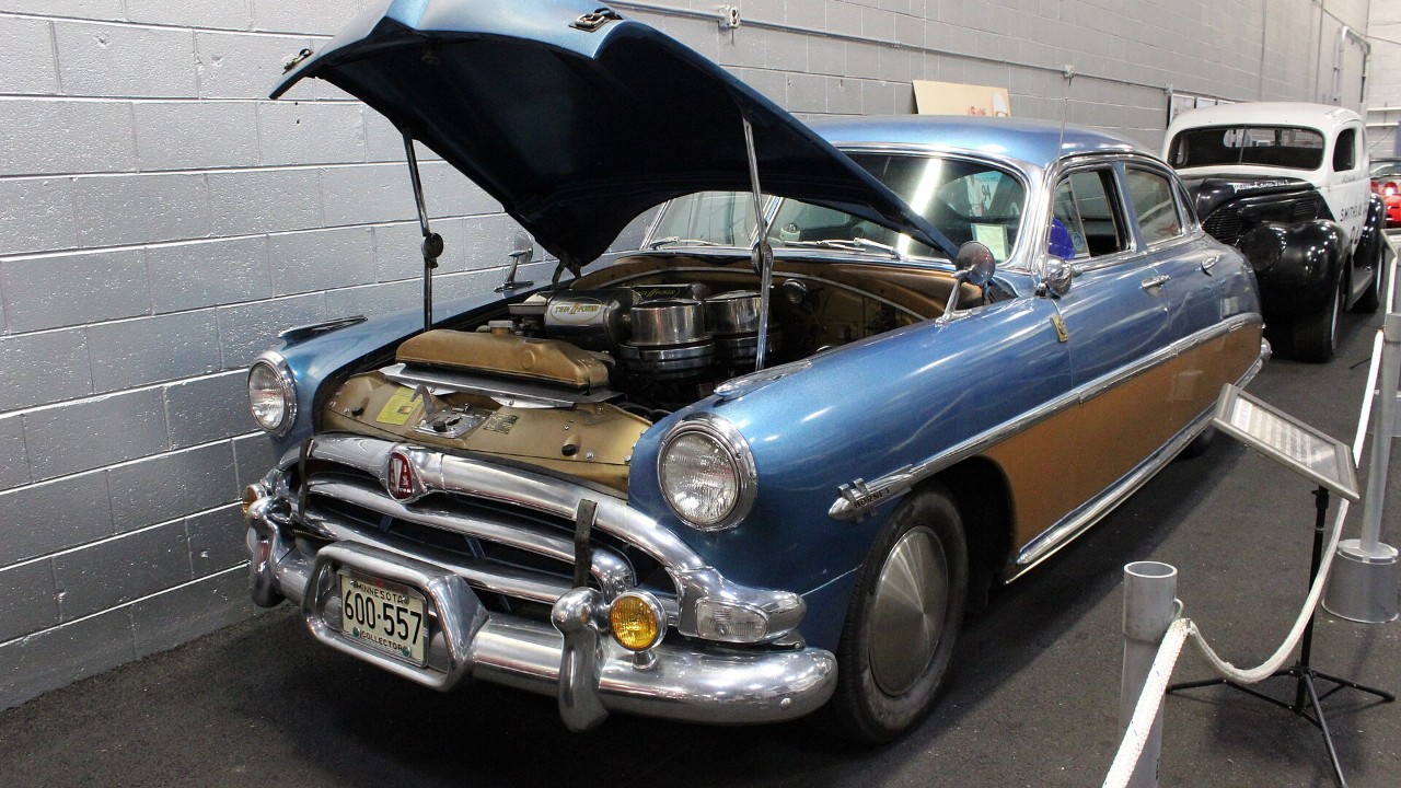 A Hudson Hornet with its hood open, showing the Twin H-Power six