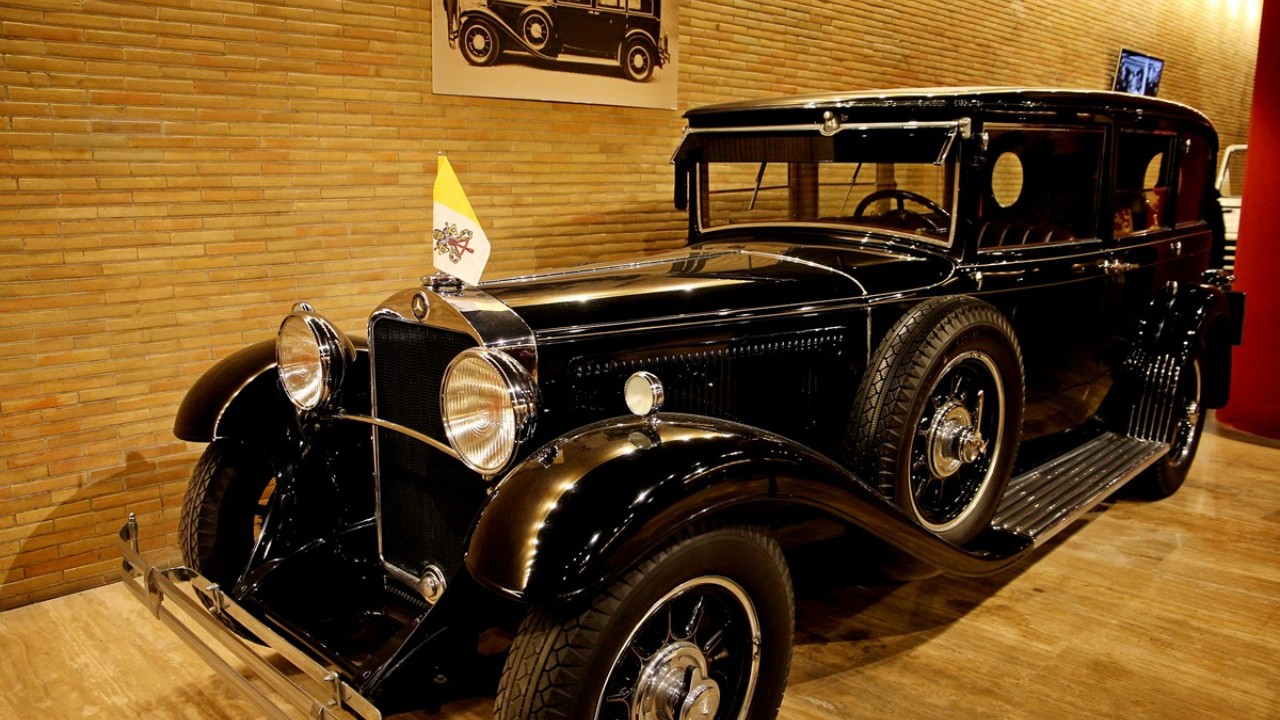 Pope Pius XI’s 1930 Mercedes Nürburg 460 has a single rear seat, trimmed in crimson brocade