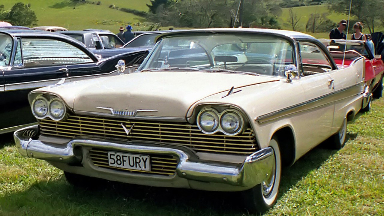 A white 1958 Plymouth Fury
