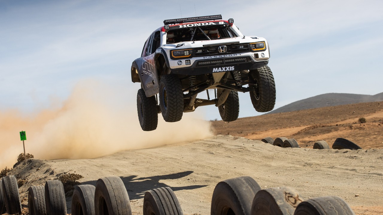 The 2025 Honda Passport race truck in the air at the Baja 1000