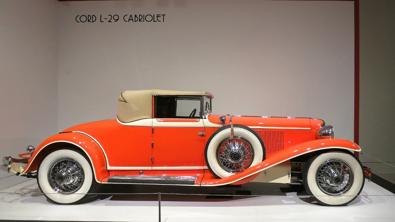 A Cord L-29 Cabriolet seen from the side, showing its long front-drive hood