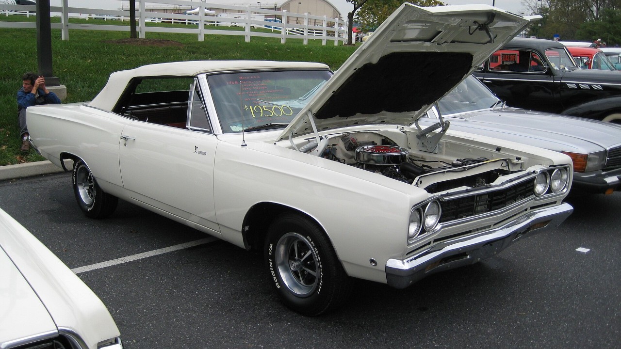 A 1968 Plymouth Road Runner with its hood open, a car built around the 383 B V8