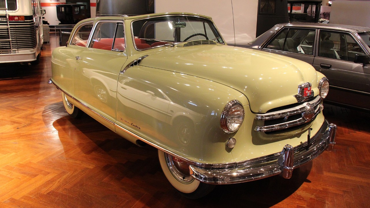 A yellow 1950 Nash Rambler convertible