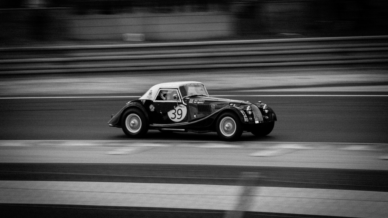 A 1961 Morgan Plus 4 Super Sports racing at the Le Mans Legend event in 2015