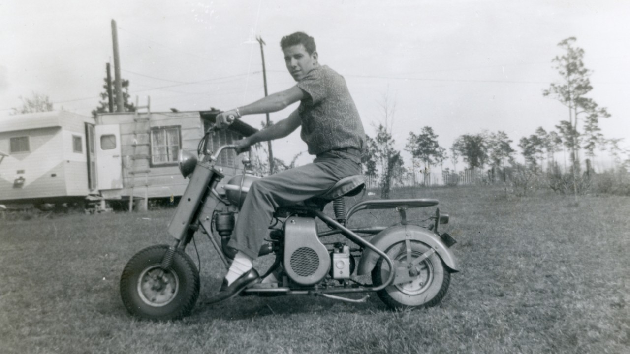 Kermit M. Brown on his Cushman Eagle scooter in Jacksonville, 1958
