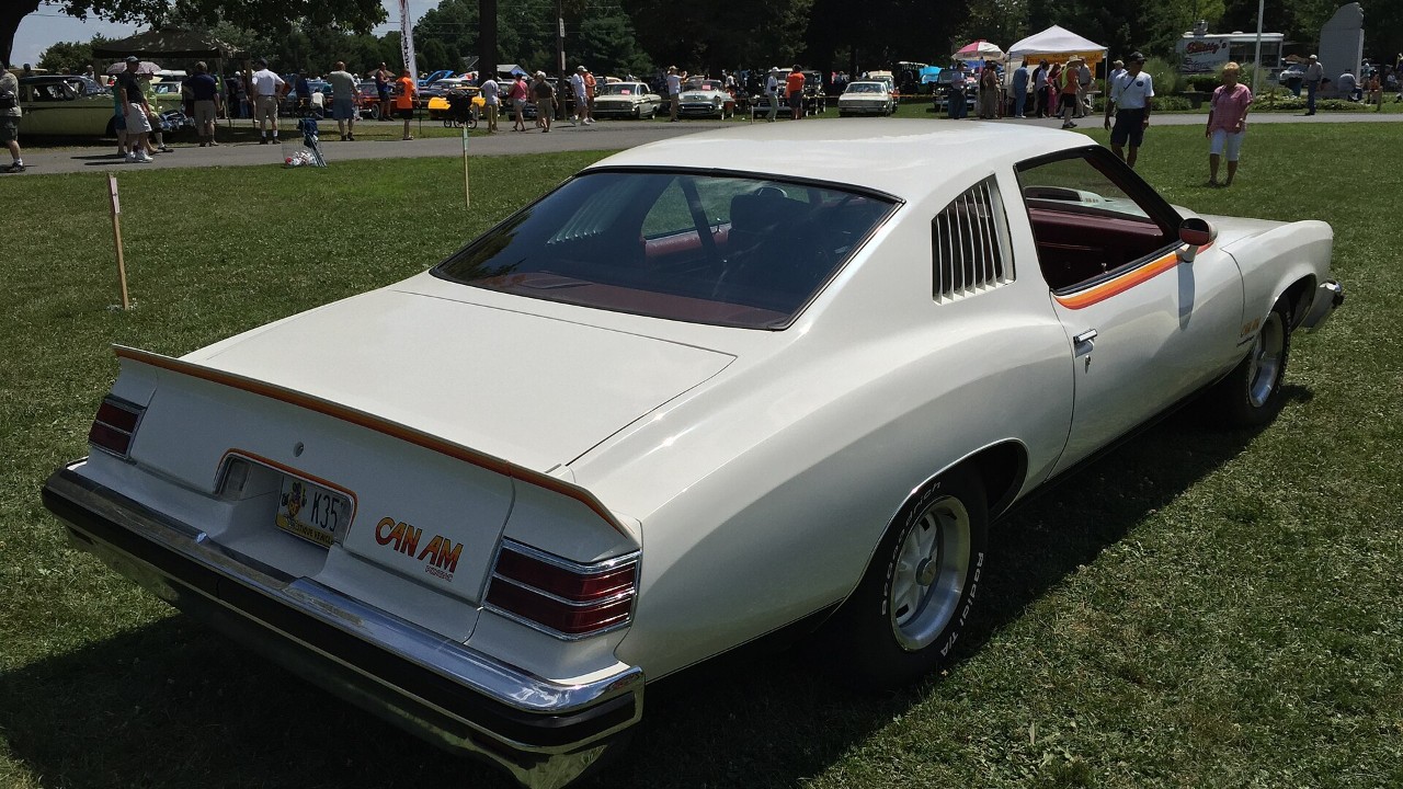 The rear of a white 1977 Pontiac Can Am, showing its Pontiac Can Am spoiler