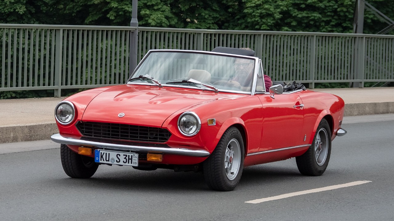 A red Fiat 124 Sport Spider