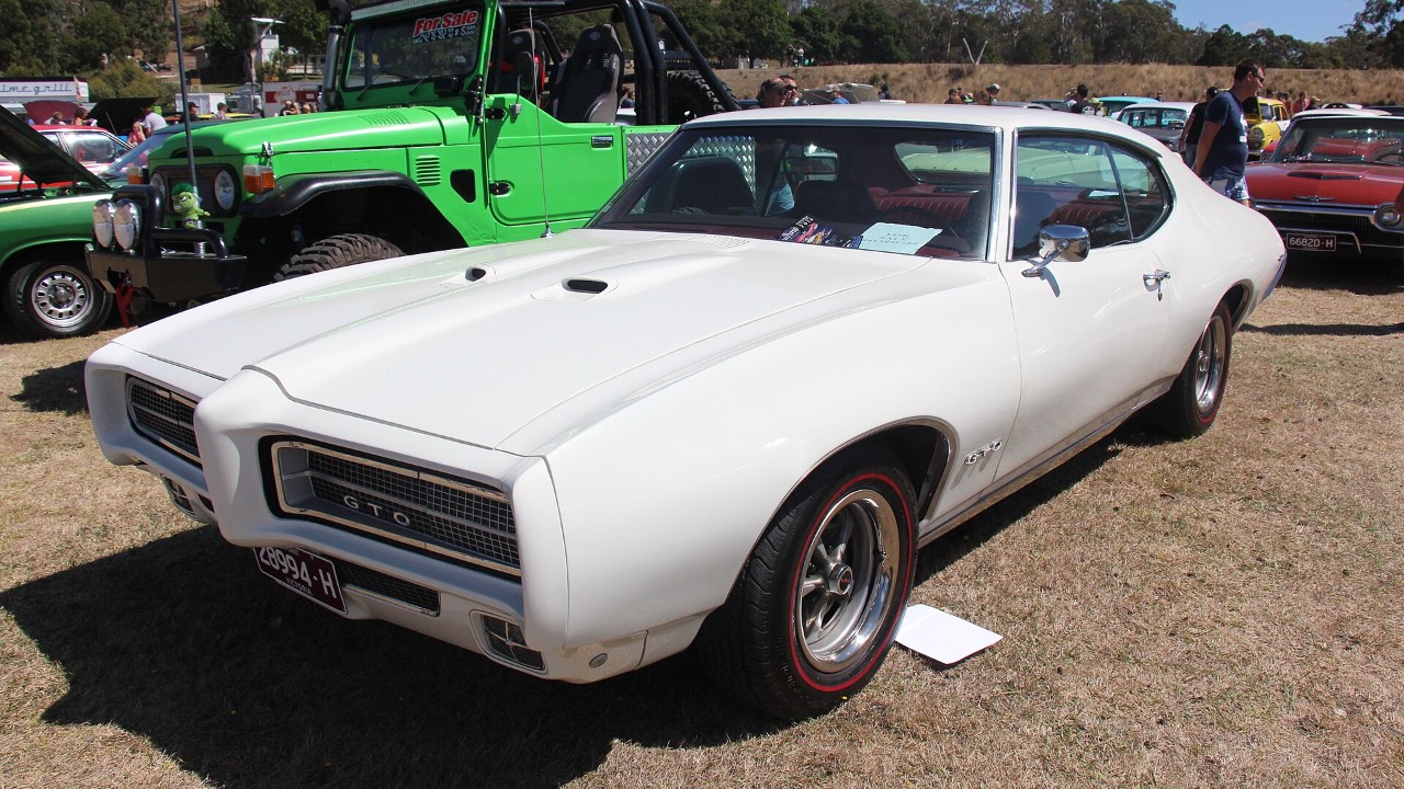 A 1969 Pontiac GTO hardtop with its twin hood scoops